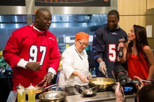 New England Patriot Super Bowl Champs, Jarvis Green and Eric Alexander battling against each other in the NECAT Culinary Cook off - Photo Credit: Samantha Robshaw Photography